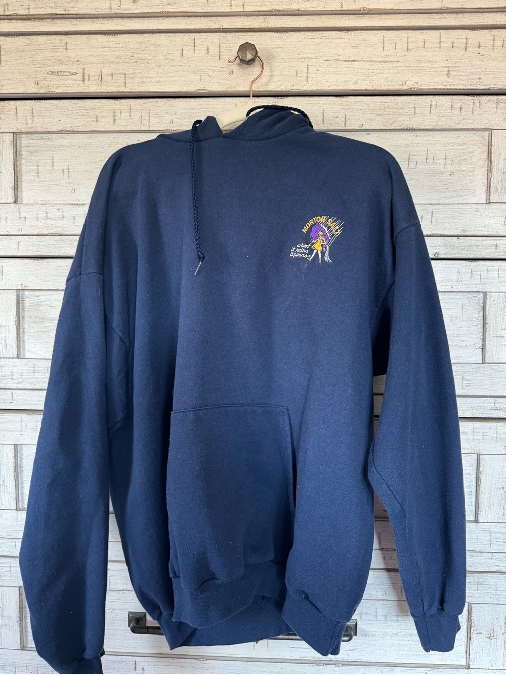 Port and Company Navy Hoodie with Small Yellow & Purple Chest Graphic
